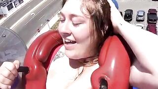 Huge cleavage on a theme park ride