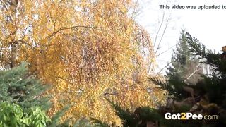 Brunette Hottie Takes Huge Long Piss On Bench In Public