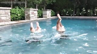 Two Bikini Teens challenging each other in pool