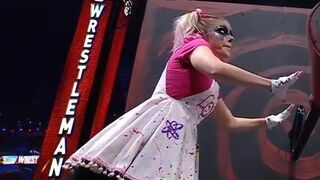 WWE - Alexa Bliss turning a crank at Wrestlemania 37