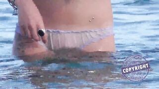 Beach girl goes for swimming in panties - watch out