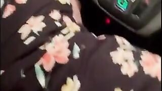 wife in car seat while husband films