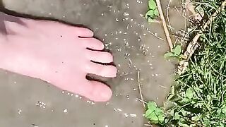 Feet Playing in a Puddle