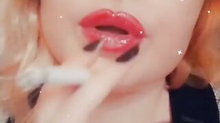 Girl with Fat Lips Smokes a Cigar