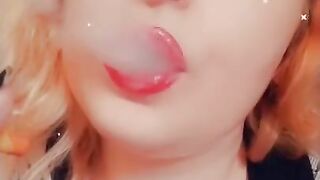 Girl with Fat Lips Smokes a Cigar