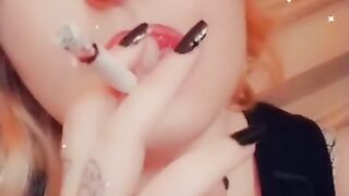 Girl with Fat Lips Smokes a Cigar