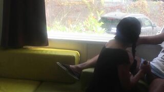 Wife giving risky blowjob in front of window in a camper van