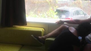 Wife giving risky blowjob in front of window in a camper van