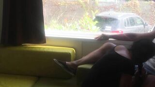 Wife giving risky blowjob in front of window in a camper van