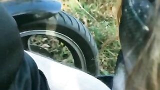 Biker's girlfriend gives him a blowjob outdoors