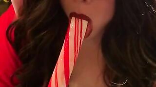 Lipstick Lesbian Sucks Giant CandyCane