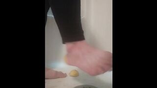 Steps on lemons in shower, grinds it in