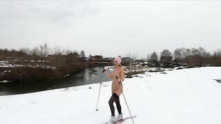 Naked girl skiing in the countryside