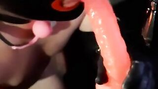 Latex slut sucking hard