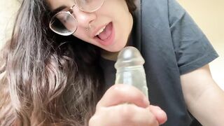 Brunette teen sucks her dildo like a real dick