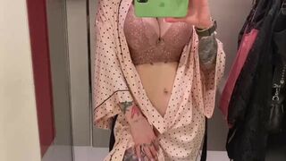 student trying on a bra on huge boobs