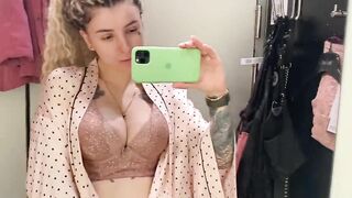 student trying on a bra on huge boobs