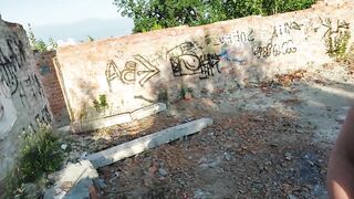 Risky walk of a naked girl in an abandoned building