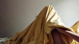 Morning masturbation under the blanket.