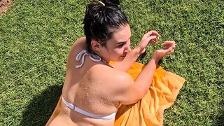 Pissing on my girlfriend lying in a bikini tanning