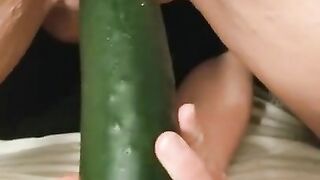 Kitty fucks cucumber